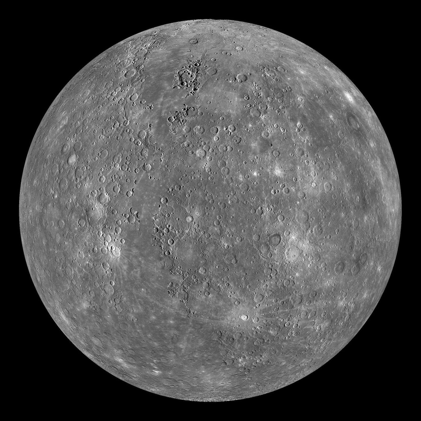 The grey, heavily cratered globe of Mercury.