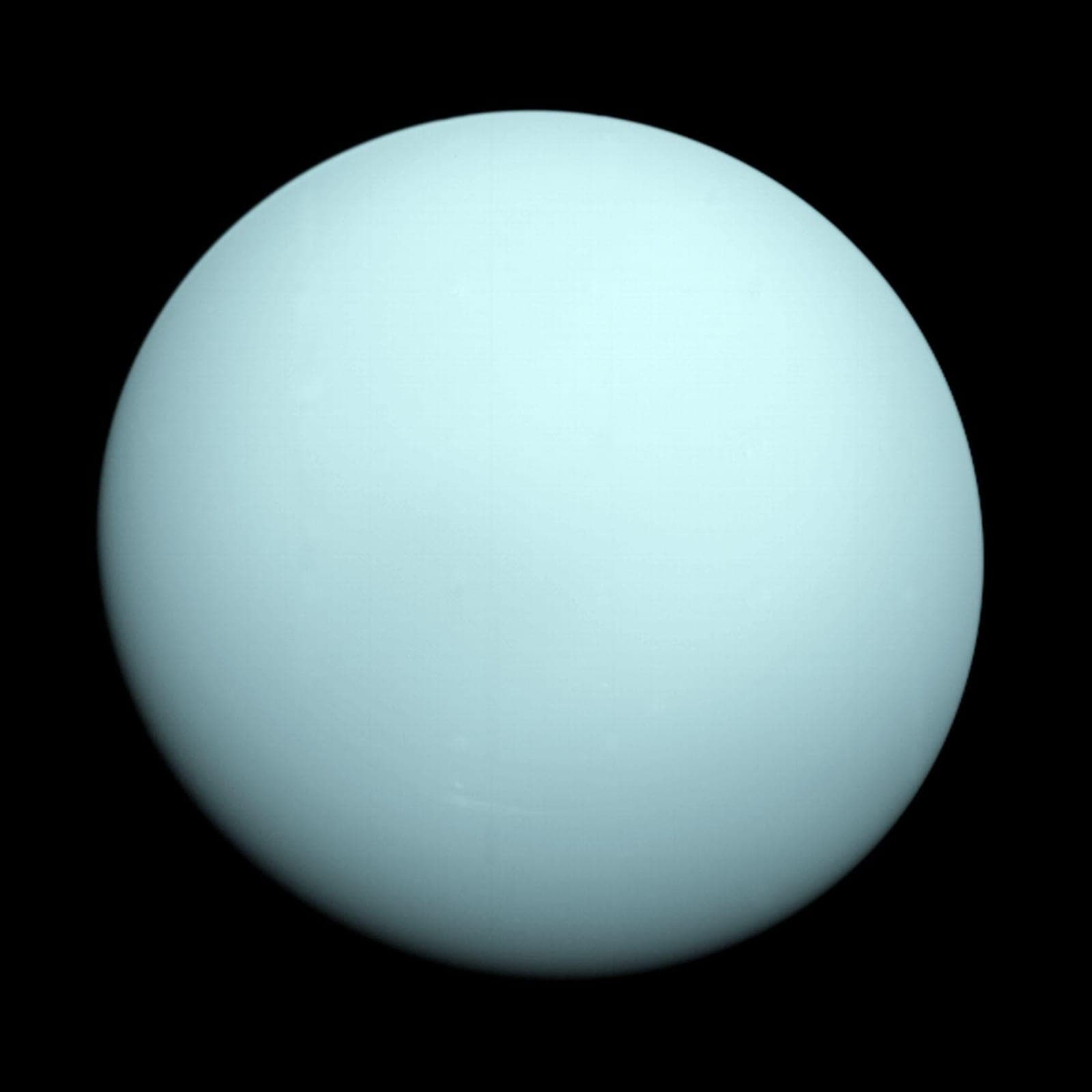 A smooth, pale blue-green globe: Uranus.